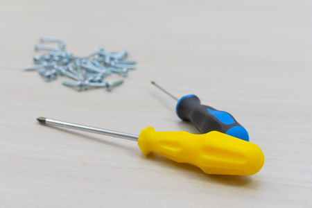 Tools worker, screwdriver, nail, screw on a white backgroundの写真素材