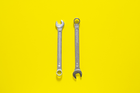 Spanner key on yellow  background. Screw driver set. Wrench spanners.  Background for your text and...