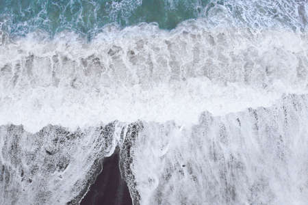 Beach and waves from top view from drone. Turquoise water background from top view. Travel concept...