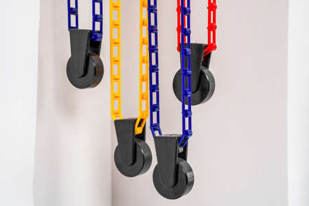 Plastic manual height adjusters for wall backdrop support system with cross bars and rolls of...