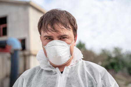 man in bio hazard protective suit with respirator mask. Novel coronavirus - 2019-nCoV, WUHAN virus conceptの写真素材