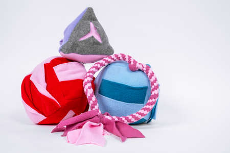 Cute pink fabric tug-of-war toy rope handle, soft ball and other items for dogs with for fun and...
