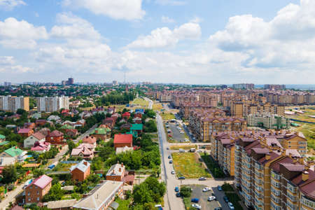 Shooting by drone city park, buildings and new residential area of town. Urban landscape from bird eye viewの写真素材