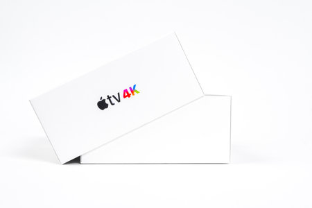 RUSSIA ROSTOV - MAY 29 2021: Container of contemporary set top box with black Apple company logo and inscription TV 4k on cover on white background closeupのeditorial素材