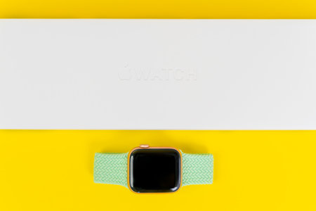 May 29, Rostov, Russia: new Apple Watch with box and bright green braided solo loop made of stretchable recycled yarn interwoven with no buckles or clasps, top viewのeditorial素材