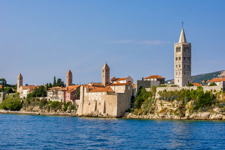 the four church tower of rab view from the adriatic seaの写真素材