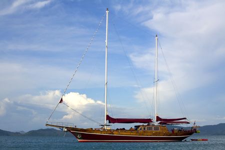 Beautiful wooden yacht on the oceanの写真素材