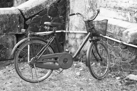 Bicycles parked in the old building yardの写真素材