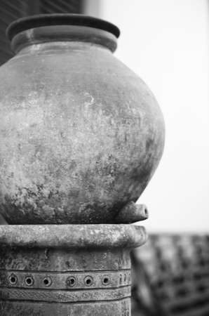 Black and white water barrel that is no longer usedの写真素材