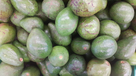 Avocado fruit in the market. Close-up of avocado fruit