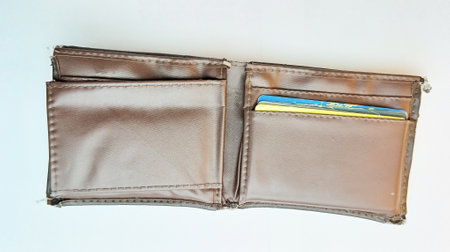 Brown leather wallet with credit card isolated on white background, clipping path