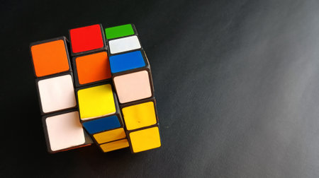 Colorful cube isolated on black background with copy space