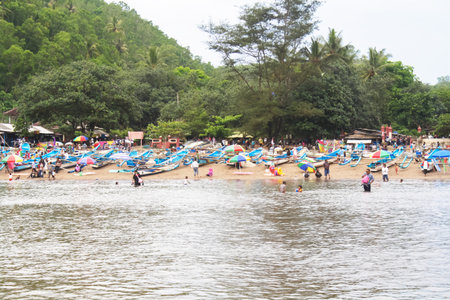 Several tourists are playing in the water at Baron Beach, Gunungkidul, Yogyakarta.のeditorial素材
