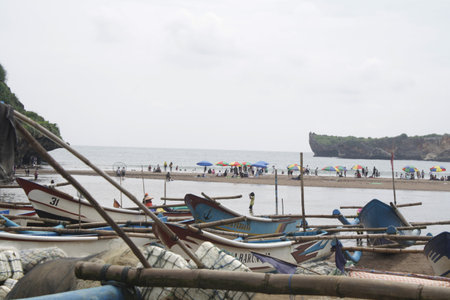 Fishing boats at Baron Beach tourist attraction, Gunungkidul, Yogyakarta, Indonesia.のeditorial素材