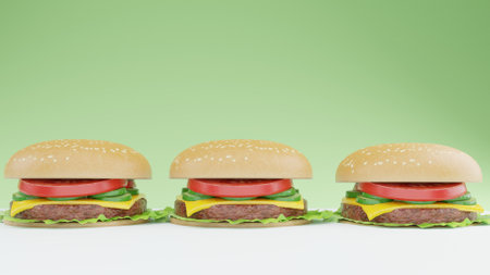 Three hamburgers on green background with copy space for text.の写真素材
