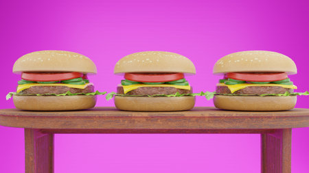 Three cheeseburgers on a wooden table against a pink backgroundの写真素材