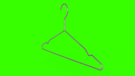 clothes hangers with green backgroundの写真素材