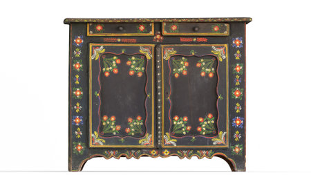 painted folk cupboard low cabinet with white backgroundの写真素材