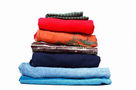 Stacks of colored clothes on white background