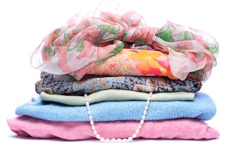 Stacks of women colored clothes on white backgroundの写真素材