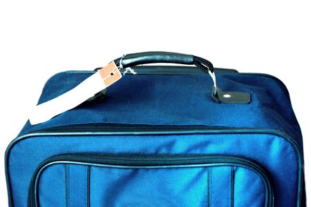 luggage with tag isolated on white backgroundの写真素材
