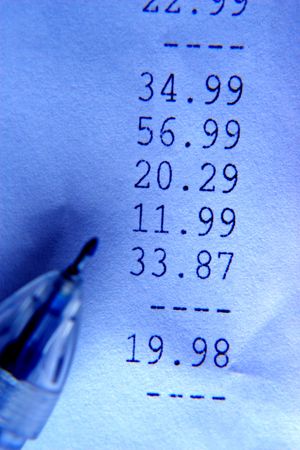 blue toned selective focus shot of financial paper and pen