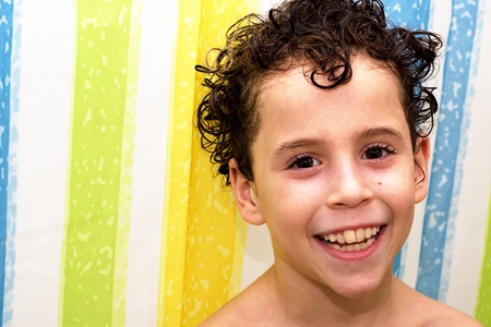 Cute smiling boy in bathroomの写真素材