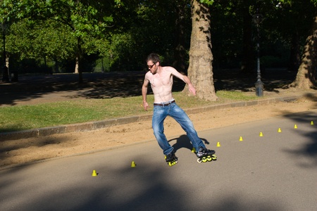 Hyde Park, London, United Kingdom - August 31, 2009. Roller (caucasian man) skating slalom.のeditorial素材