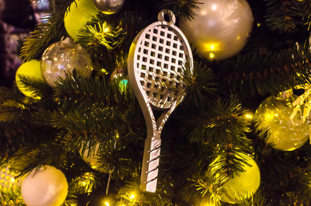christmas decorations on the tree in the form of a tennis racket. High quality photoの写真素材