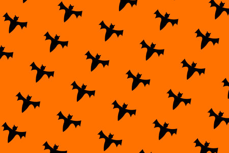 bat halloween print on orange backgroundの写真素材