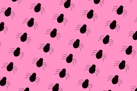 Black spider print on pink backgroundの写真素材