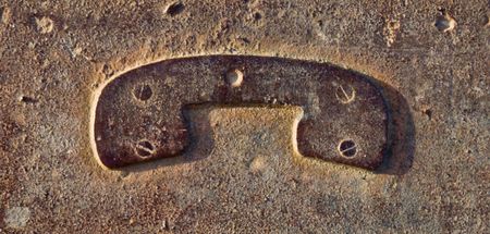 A metallic phone sign which is rust and brownの写真素材
