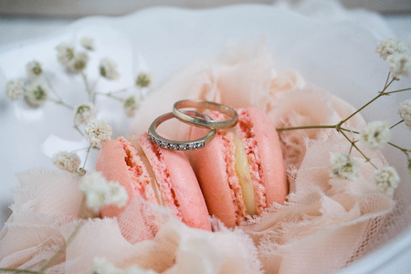 in white plate on white wooden background with some flowersの写真素材