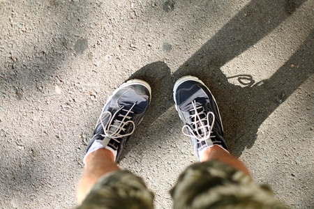 Mens feet in sneakersの写真素材