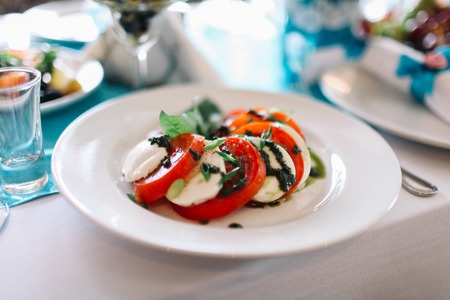 Italian salad with tomato and coatedの写真素材
