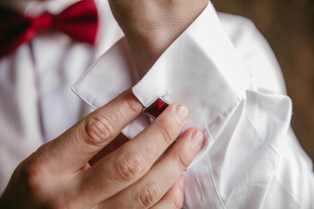 Groom button red cufflinks on shirt
