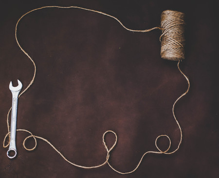 Wrench and a ball of yarnの写真素材