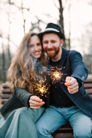 A man and woman held sparkler. Love timeの写真素材
