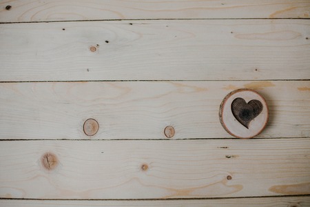 Heart of wood on wooden background. Loveの写真素材