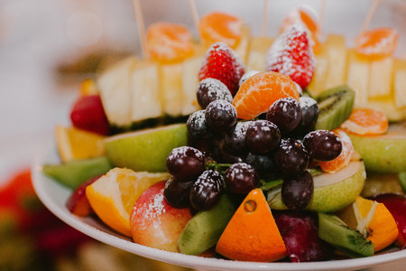 Assorted fruit on a plate.Wedding decor. Flowerの写真素材