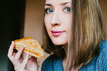 Girl eats sand cakeの写真素材