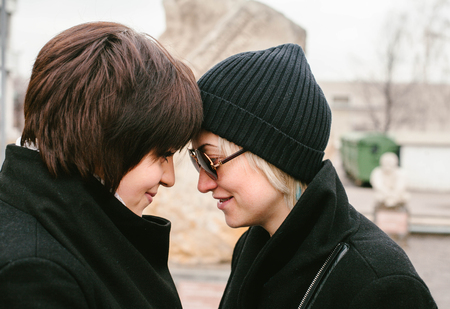 Two girls holding hands. Lovestory time. Moscowの写真素材