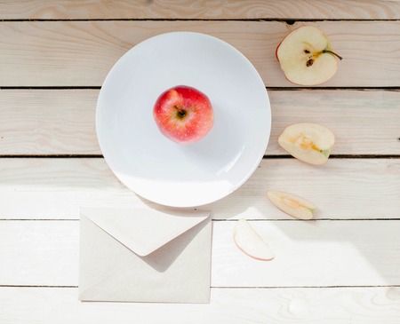 Apple cut into slices on a plateの写真素材