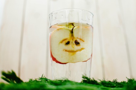 Apple is in a cut glassの写真素材