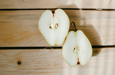 PEAR in a cut on a wooden backgroundの写真素材