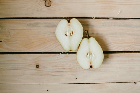 PEAR in a cut on a wooden backgroundの写真素材
