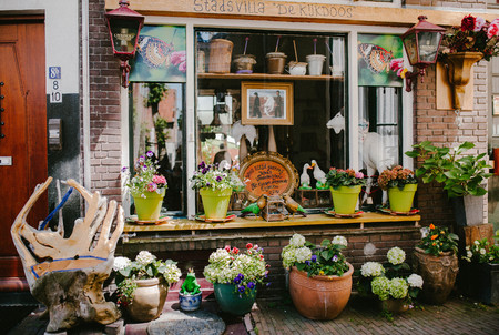Vintage shop decorated with pots of flowersの写真素材