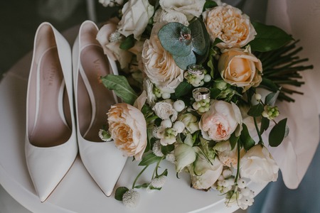 Wedding shoes and bridal bouquetの写真素材
