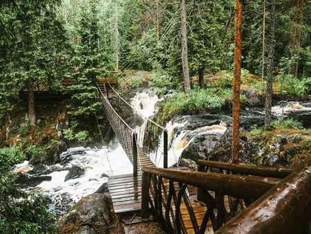 Look at the hanging bridge over the mountain river. Natureの写真素材