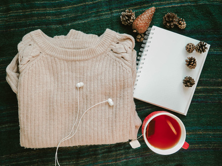 View from the top of the Notepad. sweater, headphones and a cup of tea.の写真素材